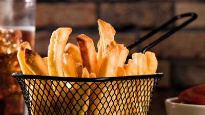 French fries in a metal serving basket