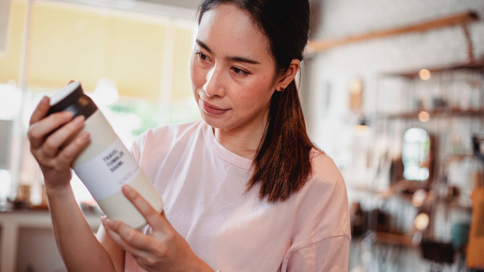 Shopper reading the label on a product in a store