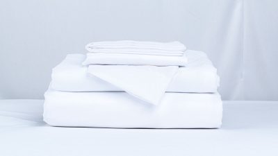 Stack of folded white bed linen
